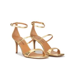 Daquesha Sandalias doradas de piel con tacón medio y pulsera