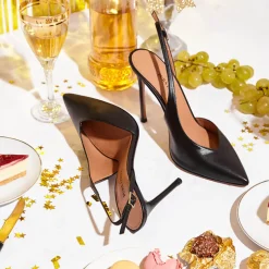 Omeya Slingbacks de tacón alto con escote asimétrico en piel color negro